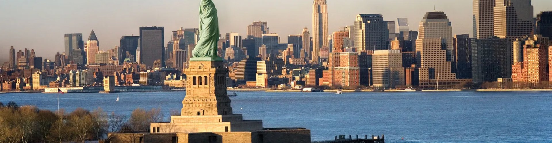New York night skyline with parked cars