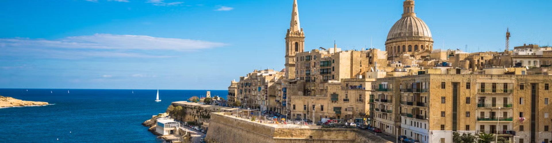 Malta Night Skyline with Parked Cars
