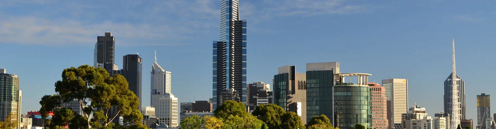 Melbourne night skyline with parked cars