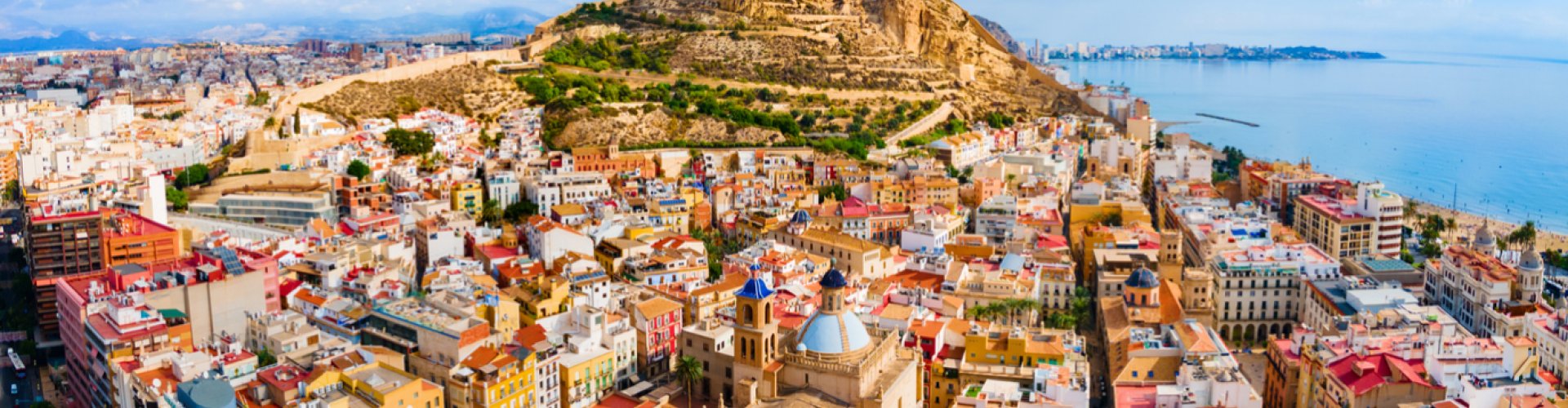 Alicante night skyline with parked cars