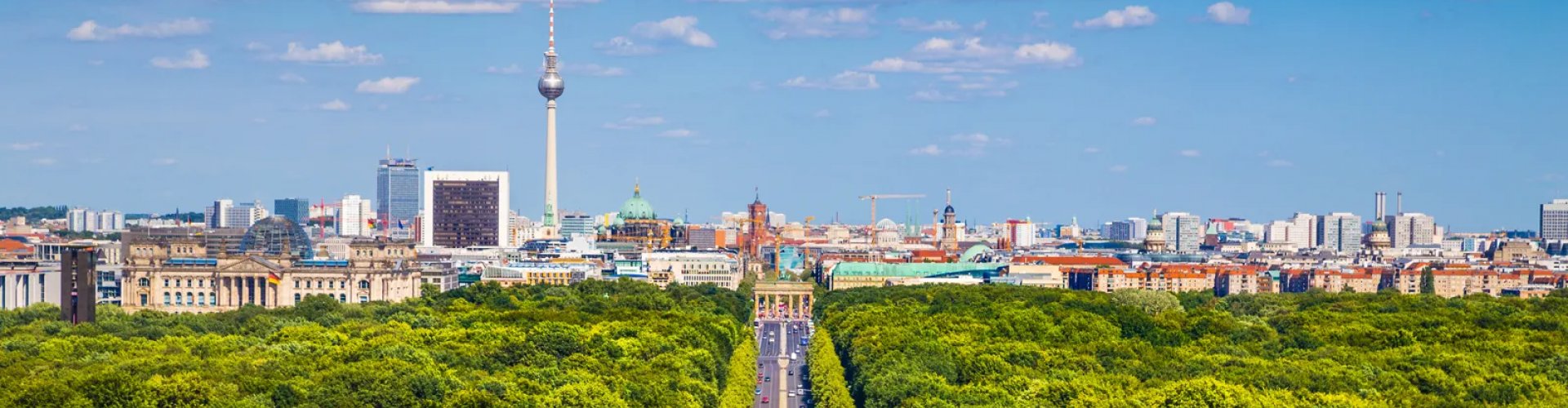 Berlin night skyline with parked cars