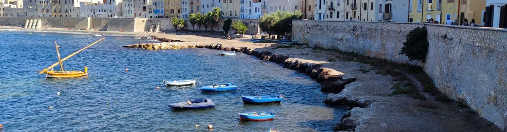 Trapani night skyline with parked cars