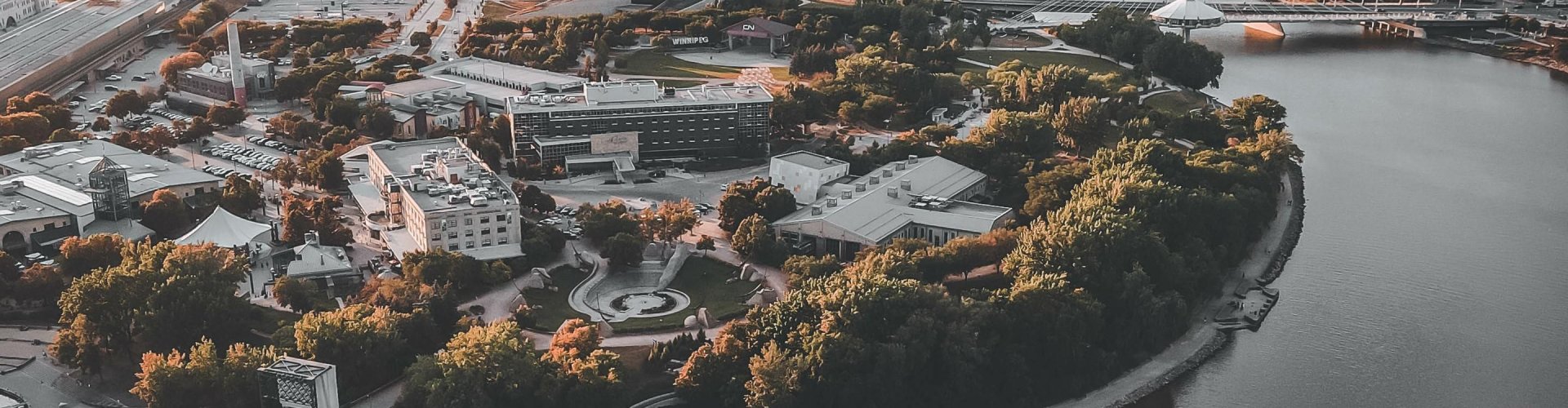 Winnipeg night skyline with parked cars