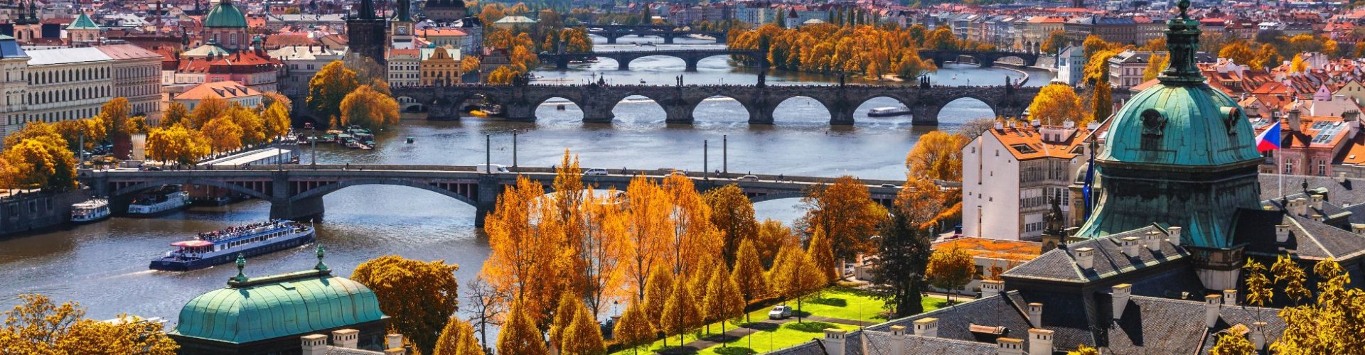 Prague night skyline with parked cars