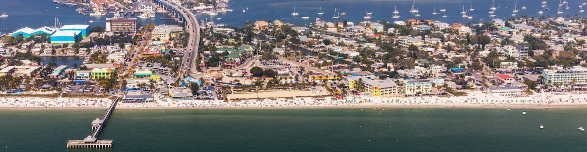 Fort Myers night skyline with parked cars