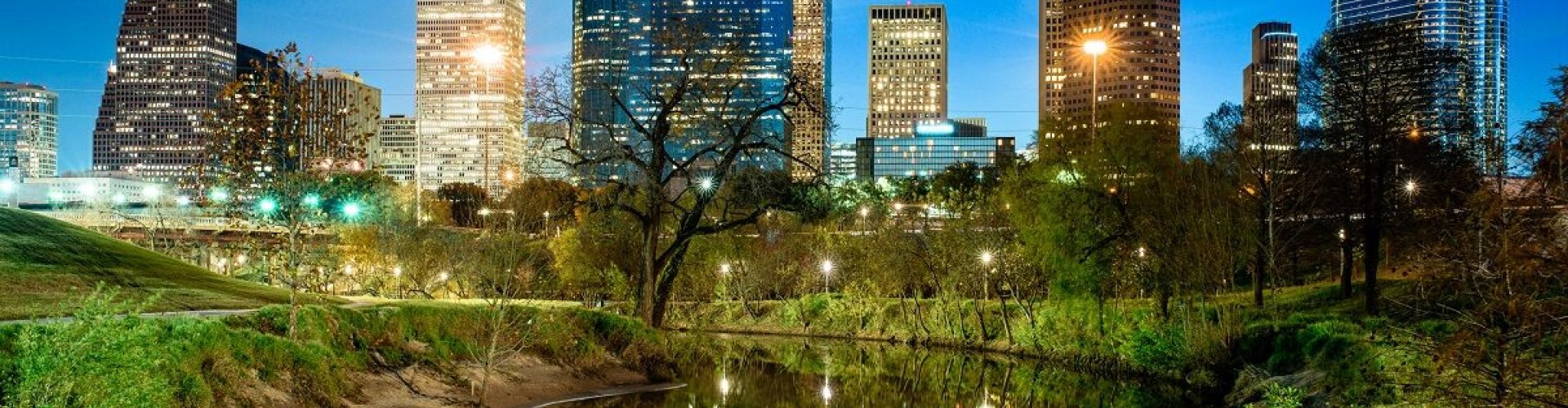 Houston night skyline with parked cars