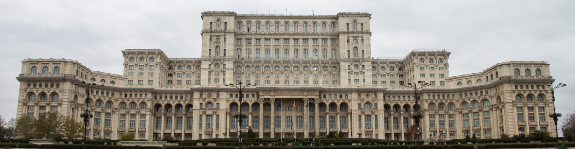 Bucharest night skyline with parked cars