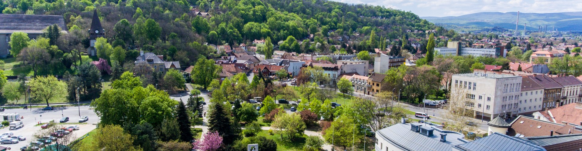 Miskolc night skyline with parked cars