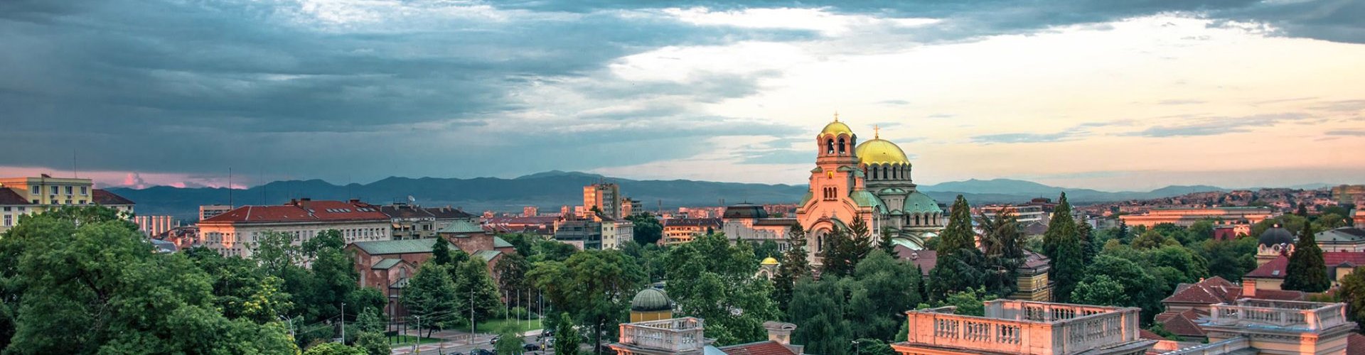 Sofia night skyline with parked cars