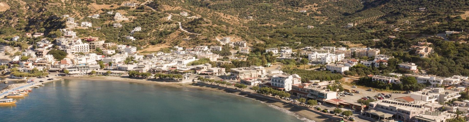 Plakias night skyline with parked cars