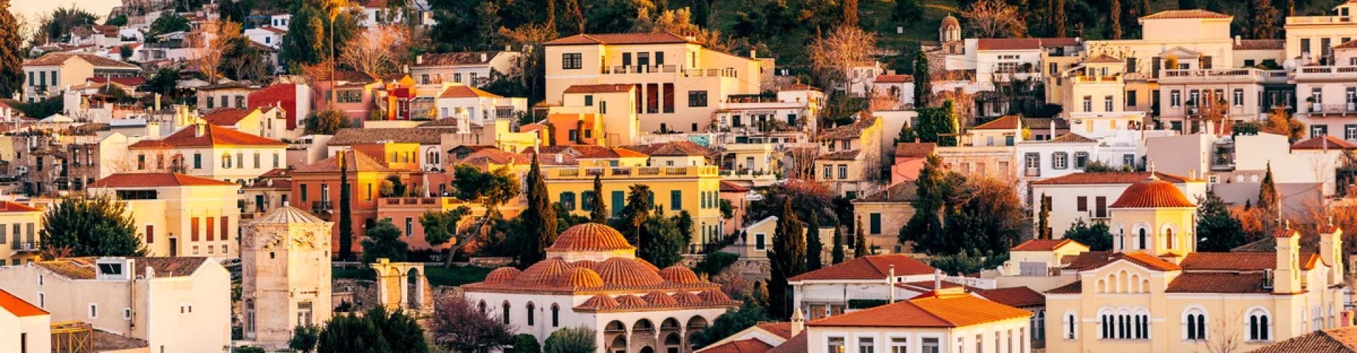 Athens night skyline with parked cars