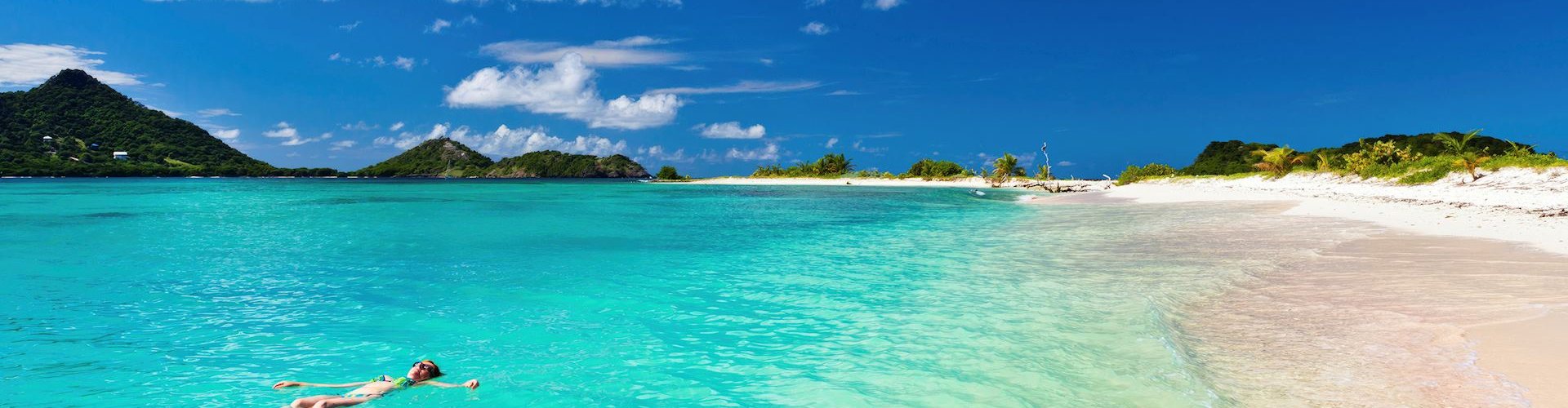 Grenada night skyline with parked cars