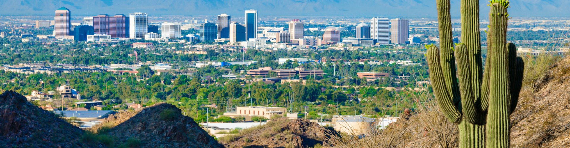 Phoenix night skyline with parked cars