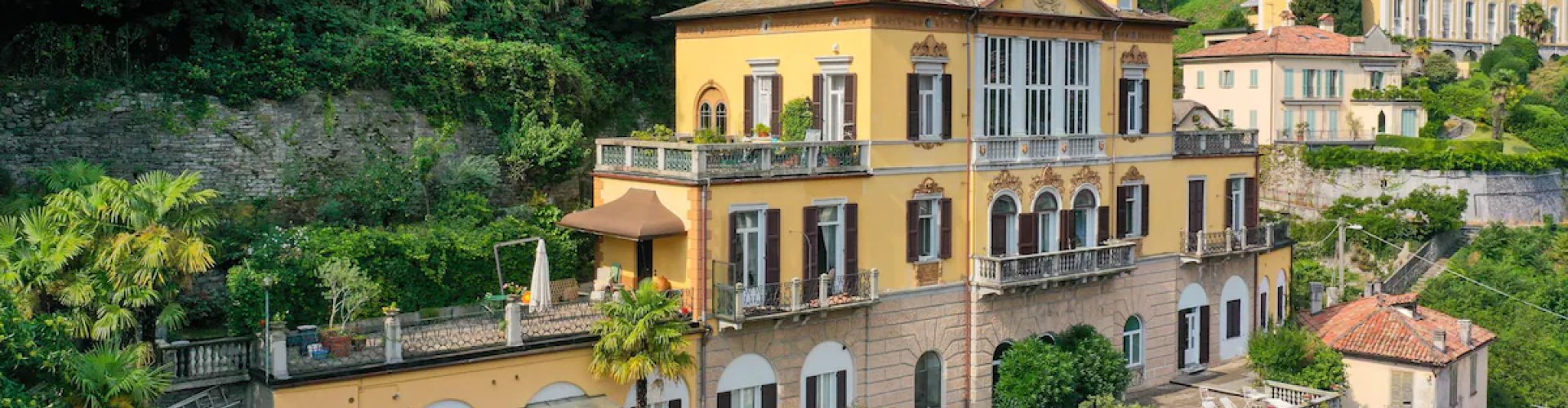 Fino Mornasco night skyline with parked cars