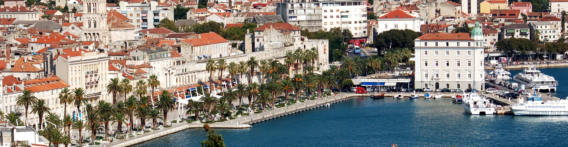 Split night skyline with parked cars