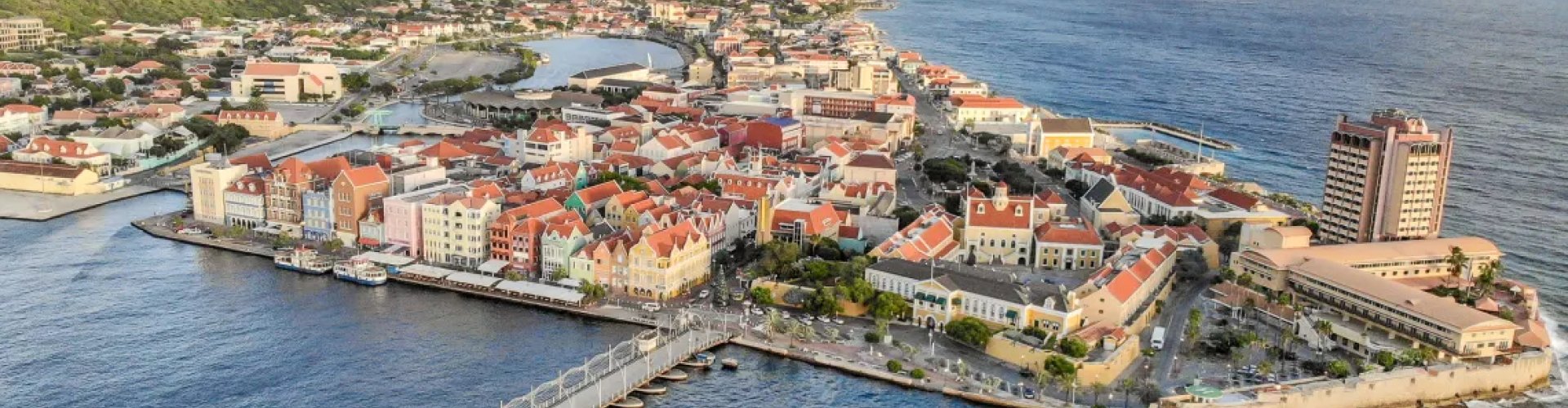 Willemstad nighttime skyline with parked cars