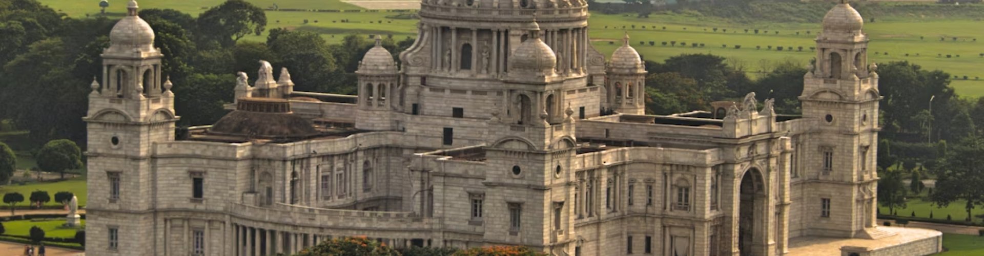 Kolkata night skyline with parked cars