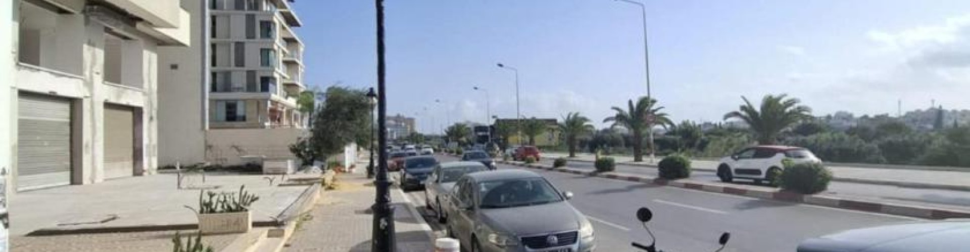 Le Bardo night skyline with parked cars