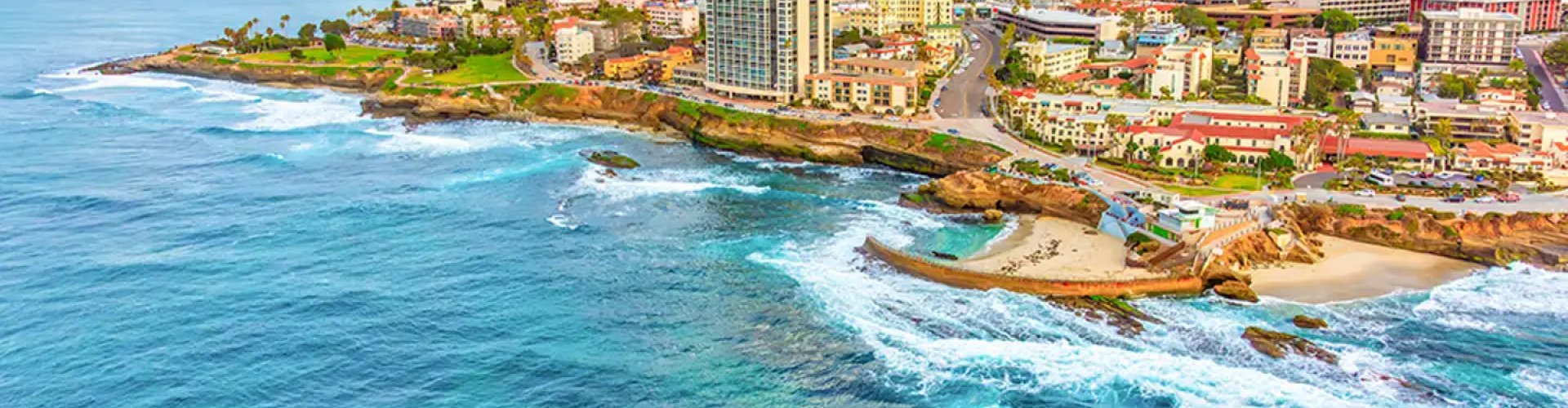 San Diego night skyline with parked cars