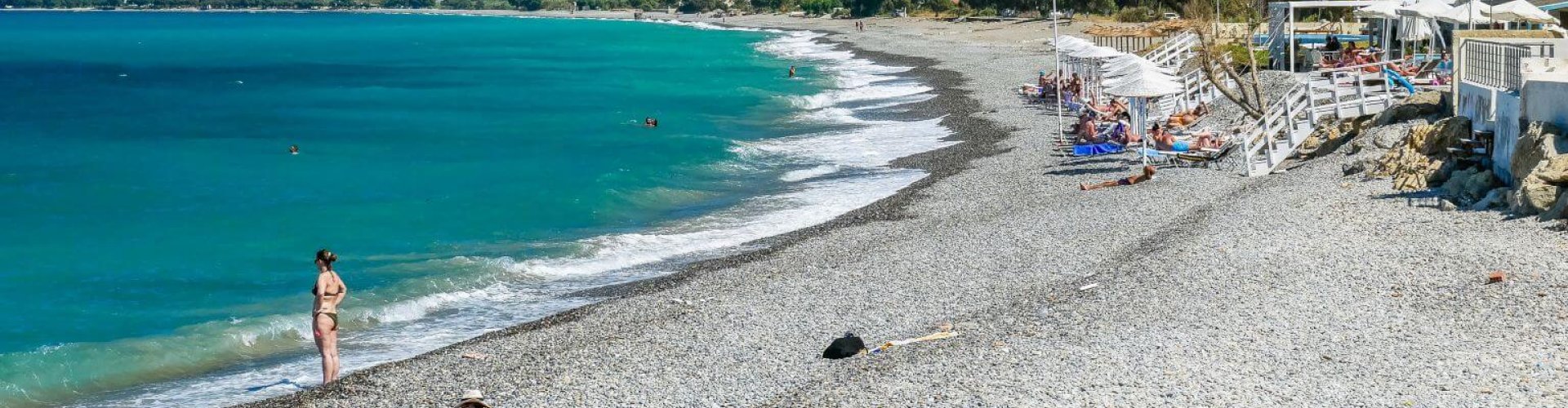 Kolimvari night skyline with parked cars