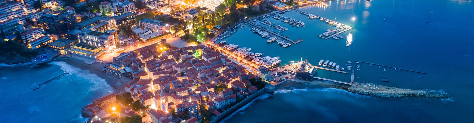 Budva night skyline with parked cars