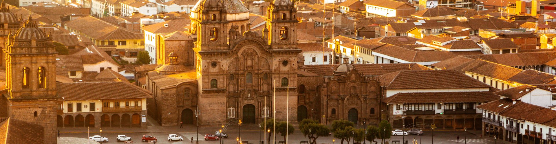Cusco night skyline with parked cars