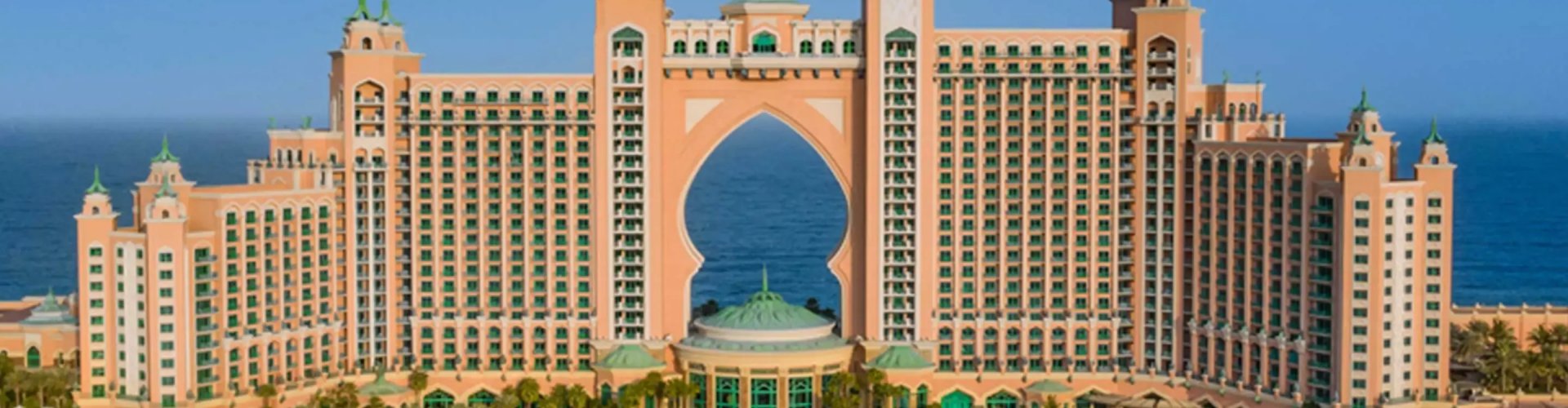 Dubai, AE night skyline with parked cars