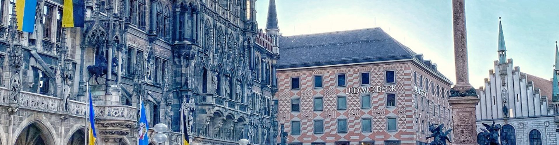 Munich night skyline with parked cars