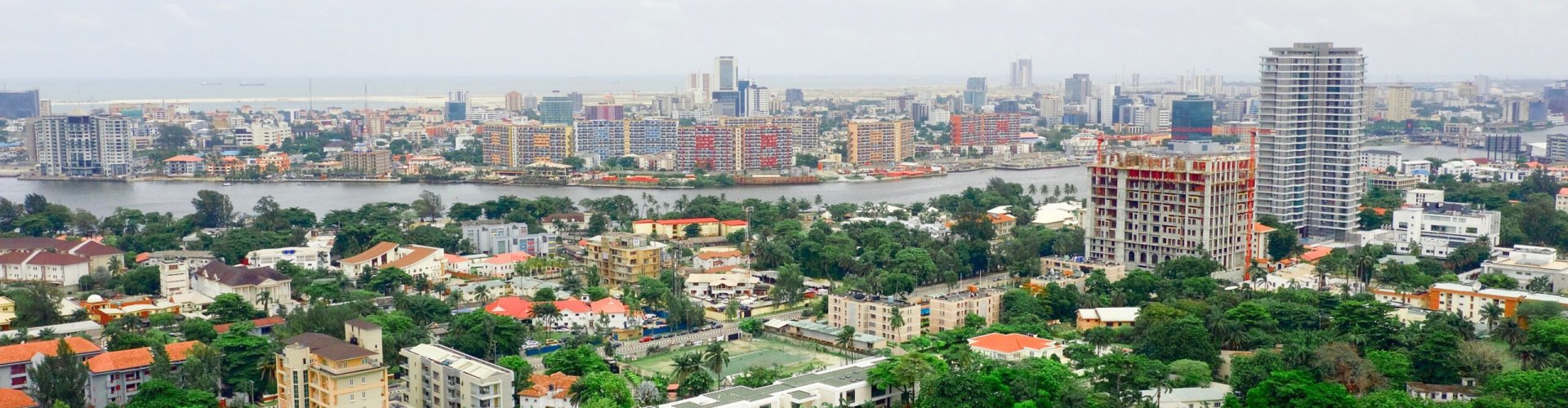 Lagos night skyline with parked cars