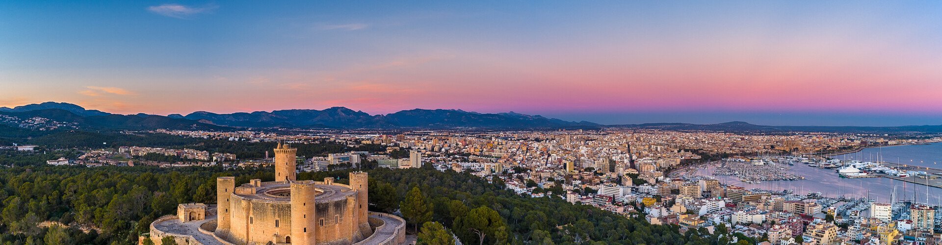 Palma de Mallorca night skyline with parked cars