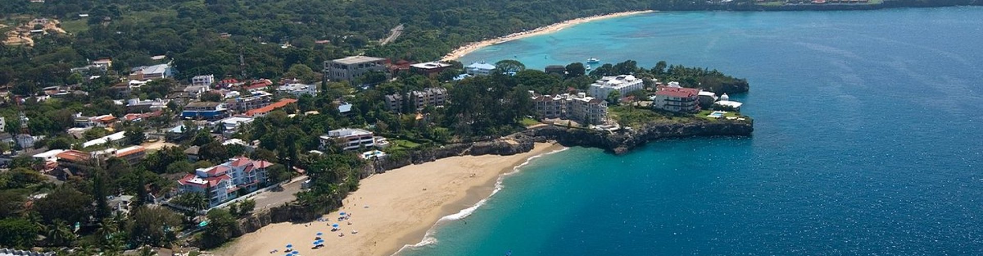 Sosúa night skyline with parked cars