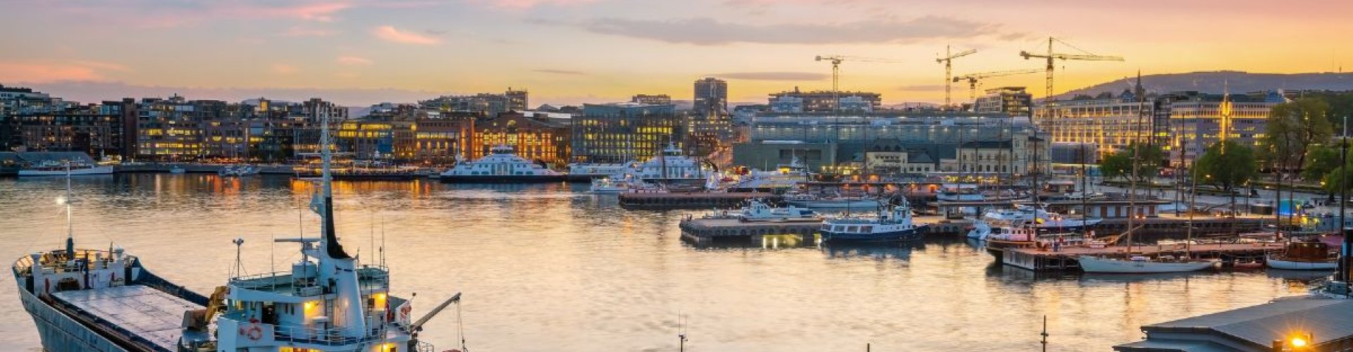 Oslo night skyline with parked cars