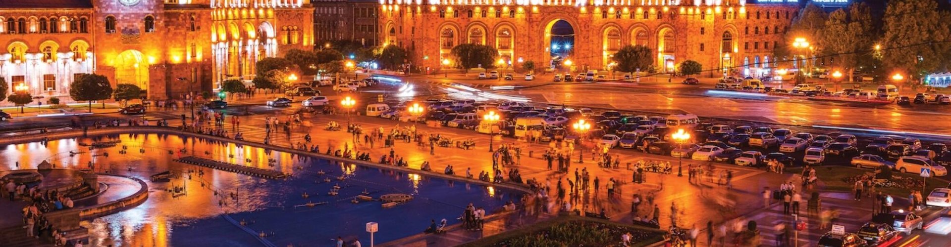 Yerevan night skyline with parked cars
