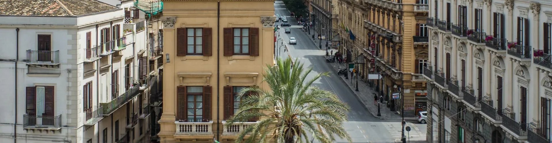 Palermo night skyline with parked cars