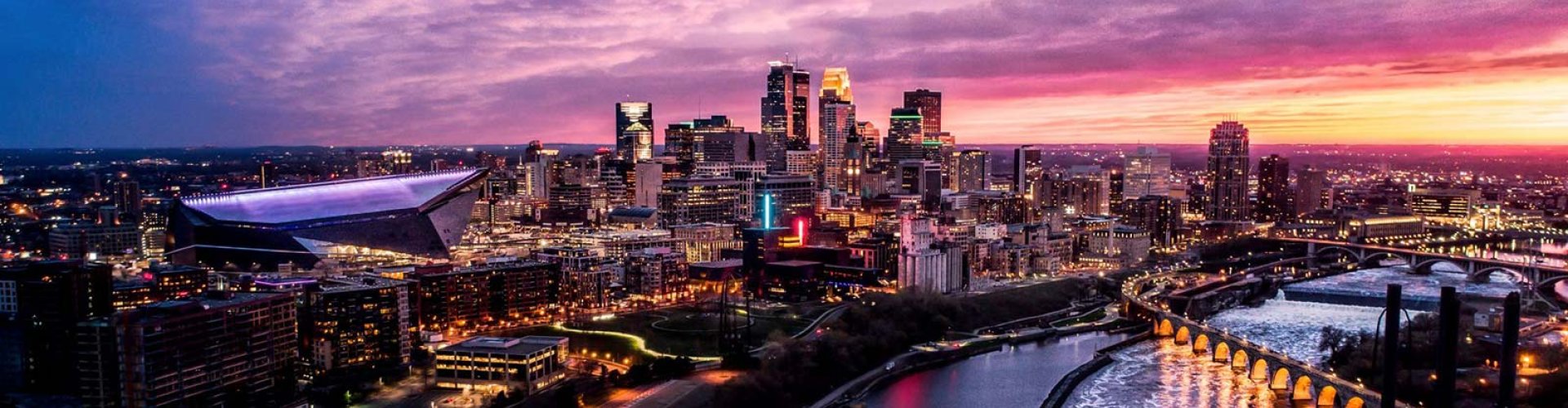 Minneapolis night skyline with parked cars