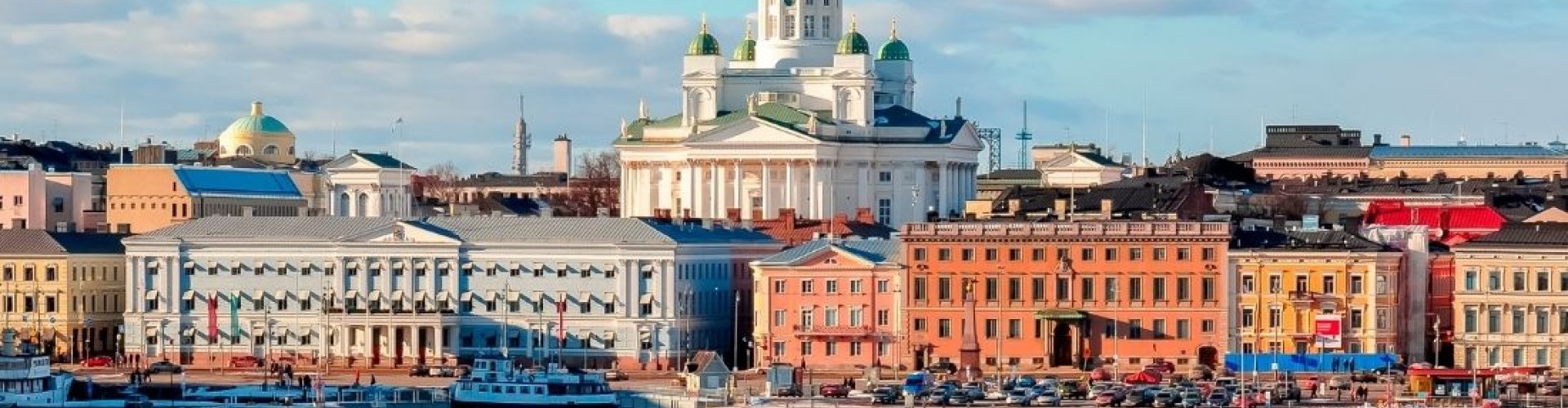 Helsinki night skyline with parked cars