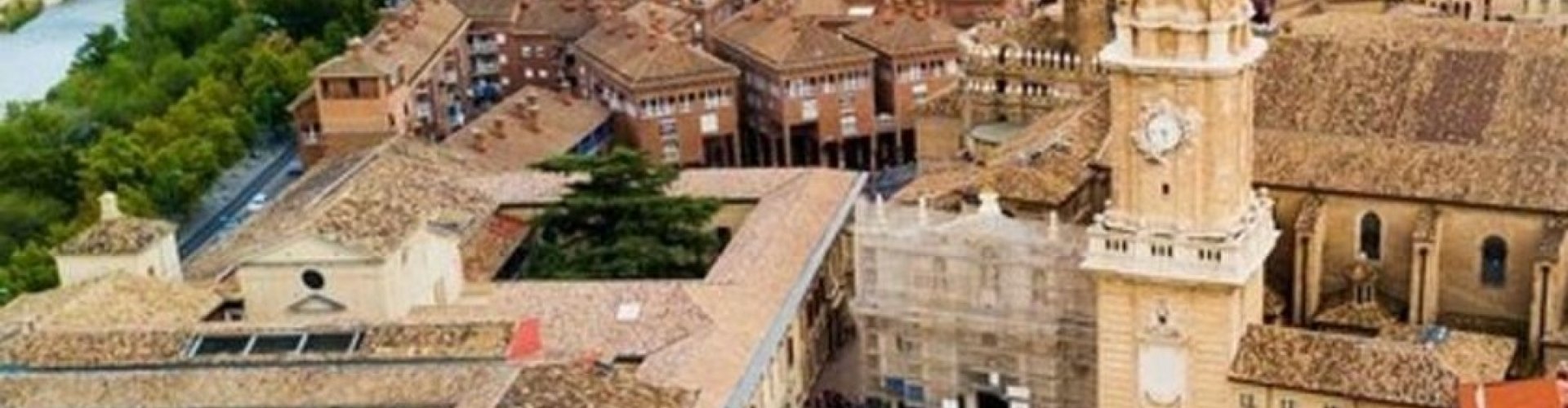 Zaragoza night skyline with parked cars