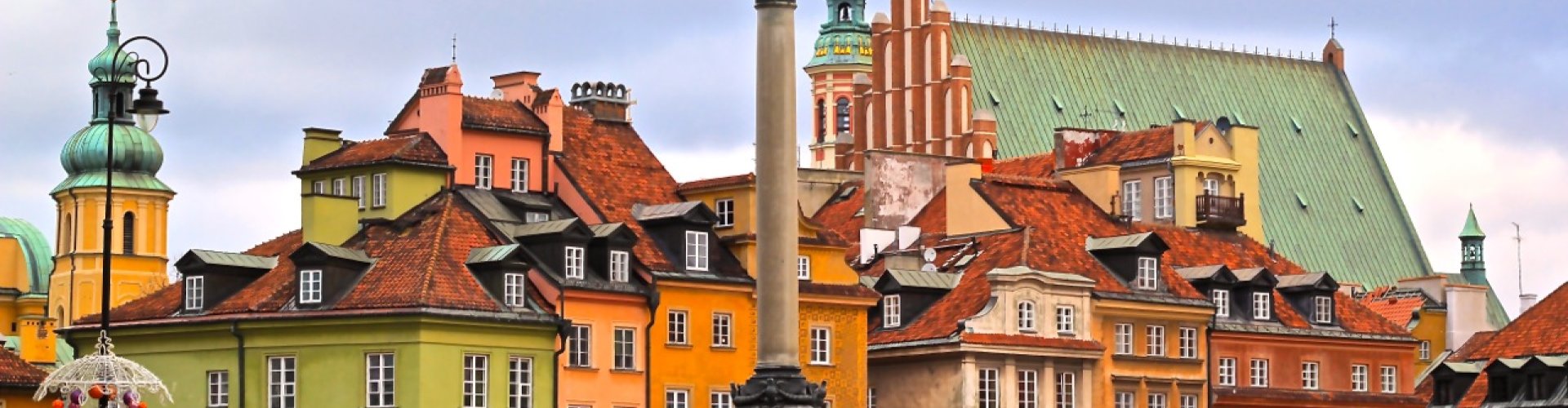 Warsaw night skyline with parked cars