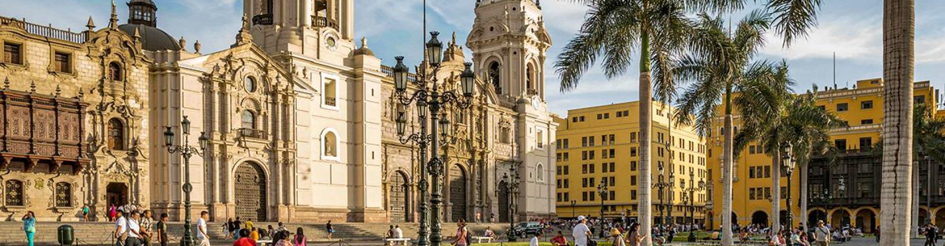 Lima night skyline with parked cars