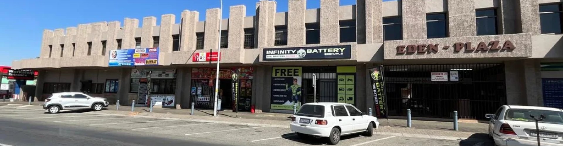 Edenvale night skyline with parked cars