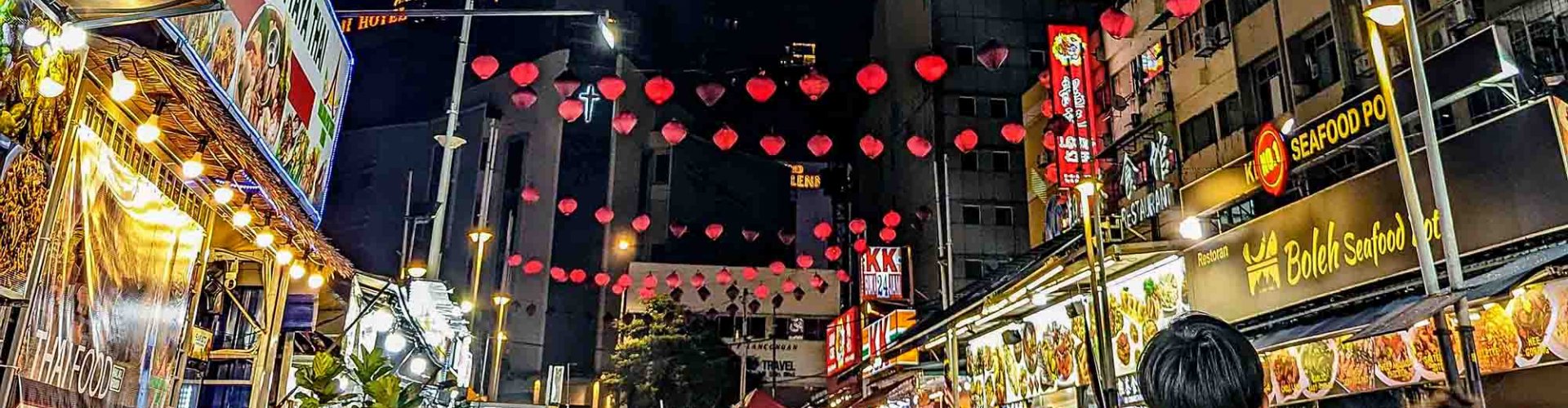 Kuala Lumpur night skyline with parked cars