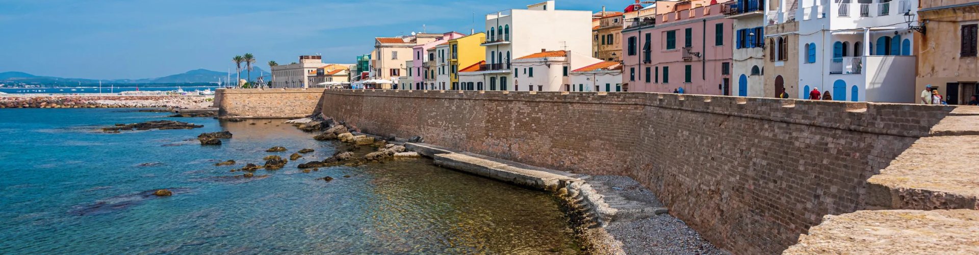 Night Skyline of Alghero with Parked Cars