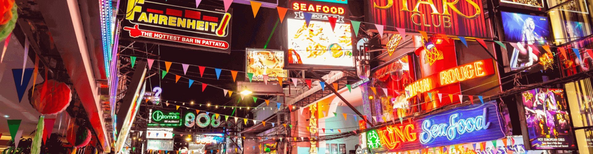 Bangkok night skyline with parked cars