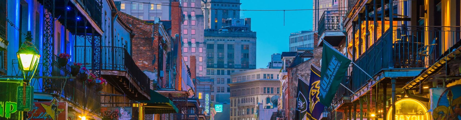 New Orleans night skyline with parked cars