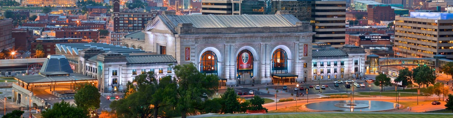 Kansas City night skyline with parked cars