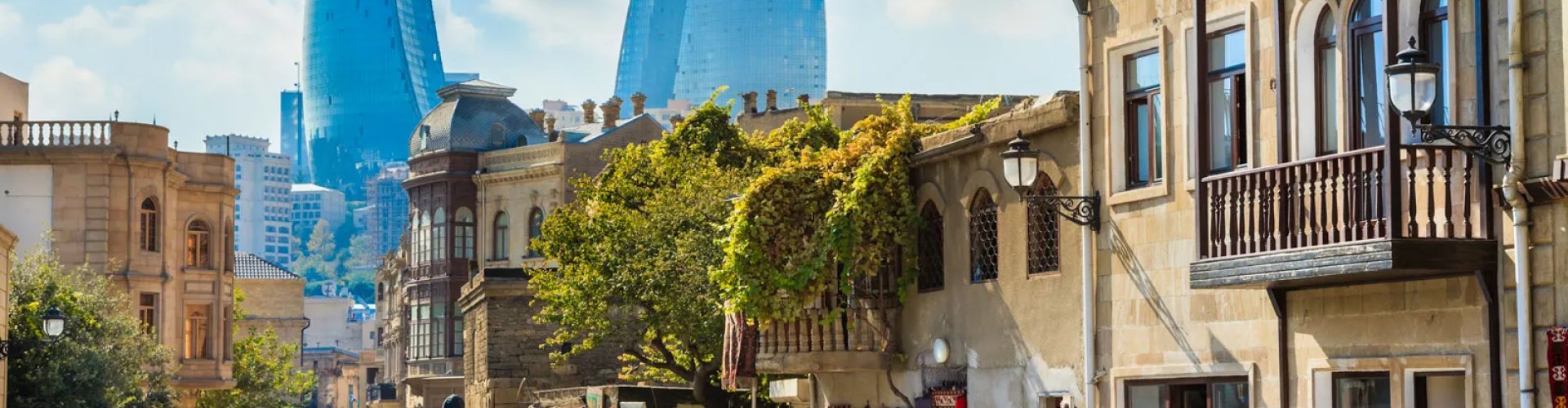 Baku night skyline with parked cars