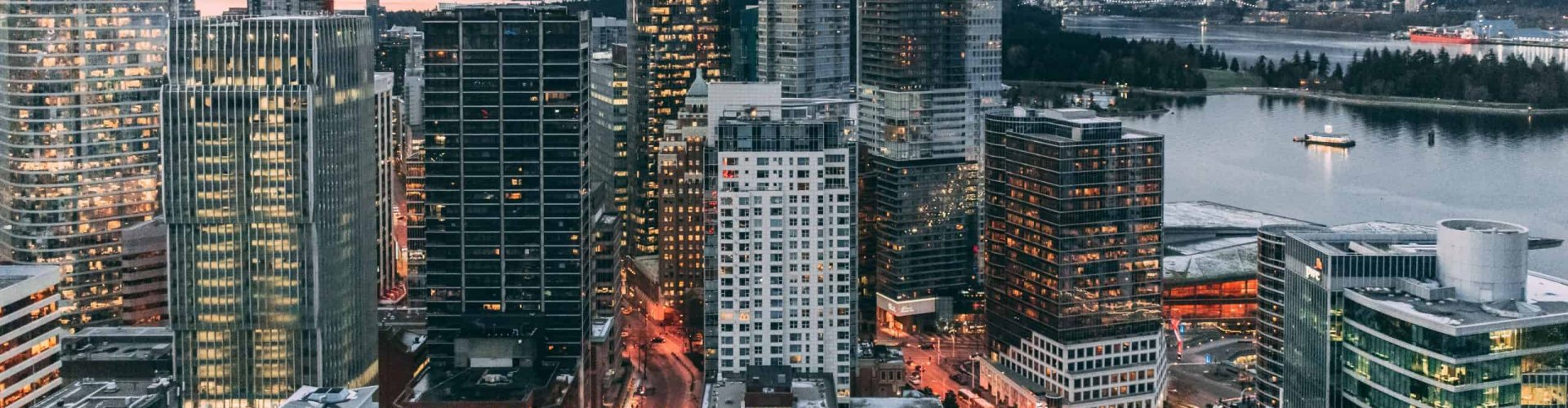 Vancouver night skyline with parked cars