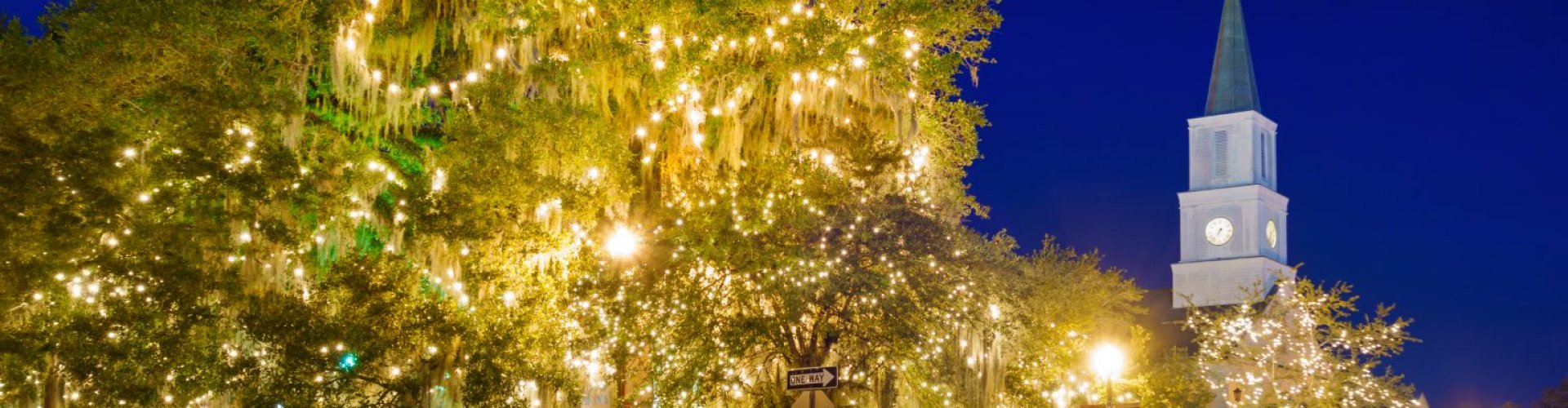 Tallahassee night skyline with parked cars